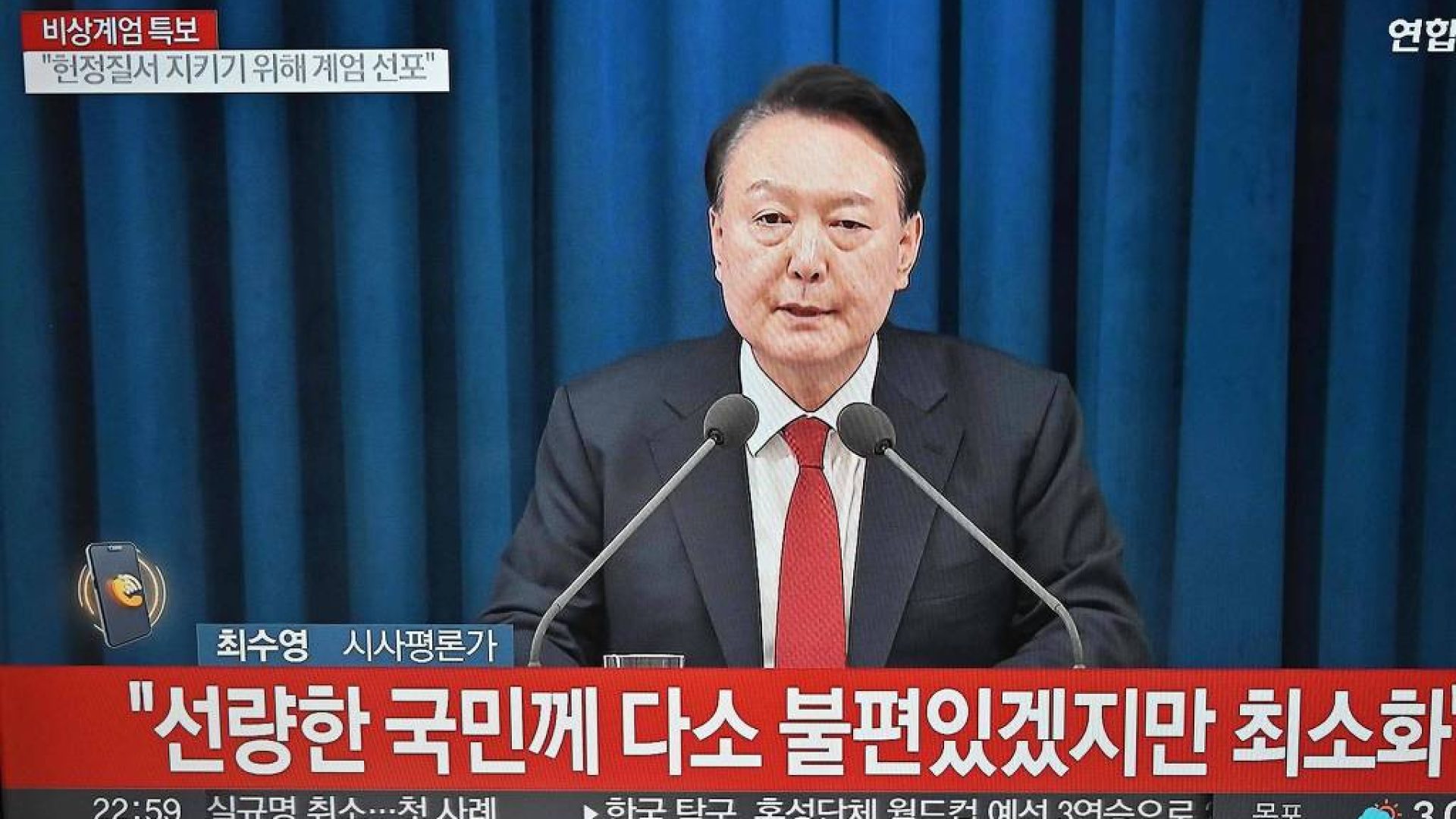 O presidente da Coreia do Sul, Yoon Suk-yeol, declara a lei marcial em pronunciamento na TV - Junt Yeon-je/AFP
