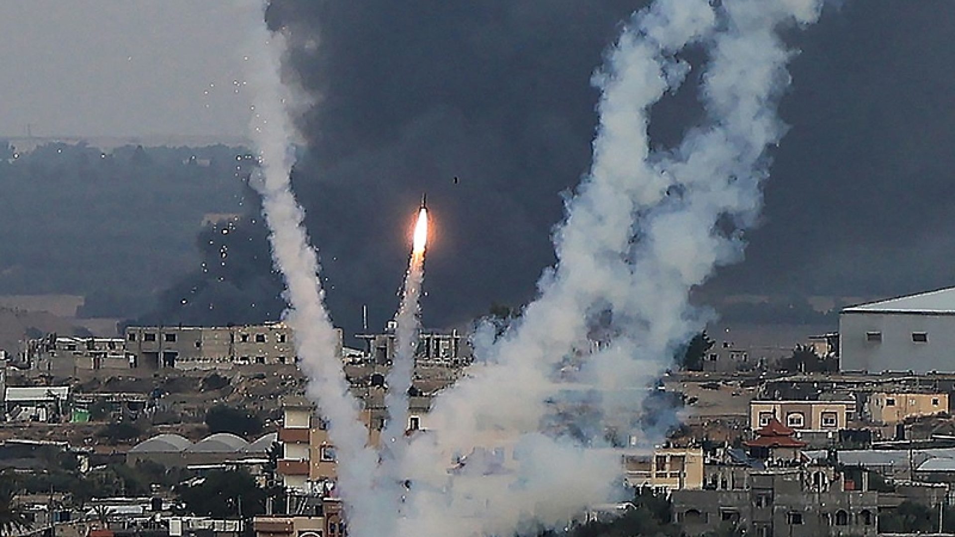 Palestinian militants fire rockets towards Israel from Rafah, southern Gaza Strip, on October 11, 2023. Israel on October 11 kept up its bombardment of Hamas targets in the Gaza Strip, as Prime Minister Benjamin Netanyahu and a political rival announced an emergency government for the duration of the conflict that has already killed thousands. (Photo by SAID KHATIB / AFP)