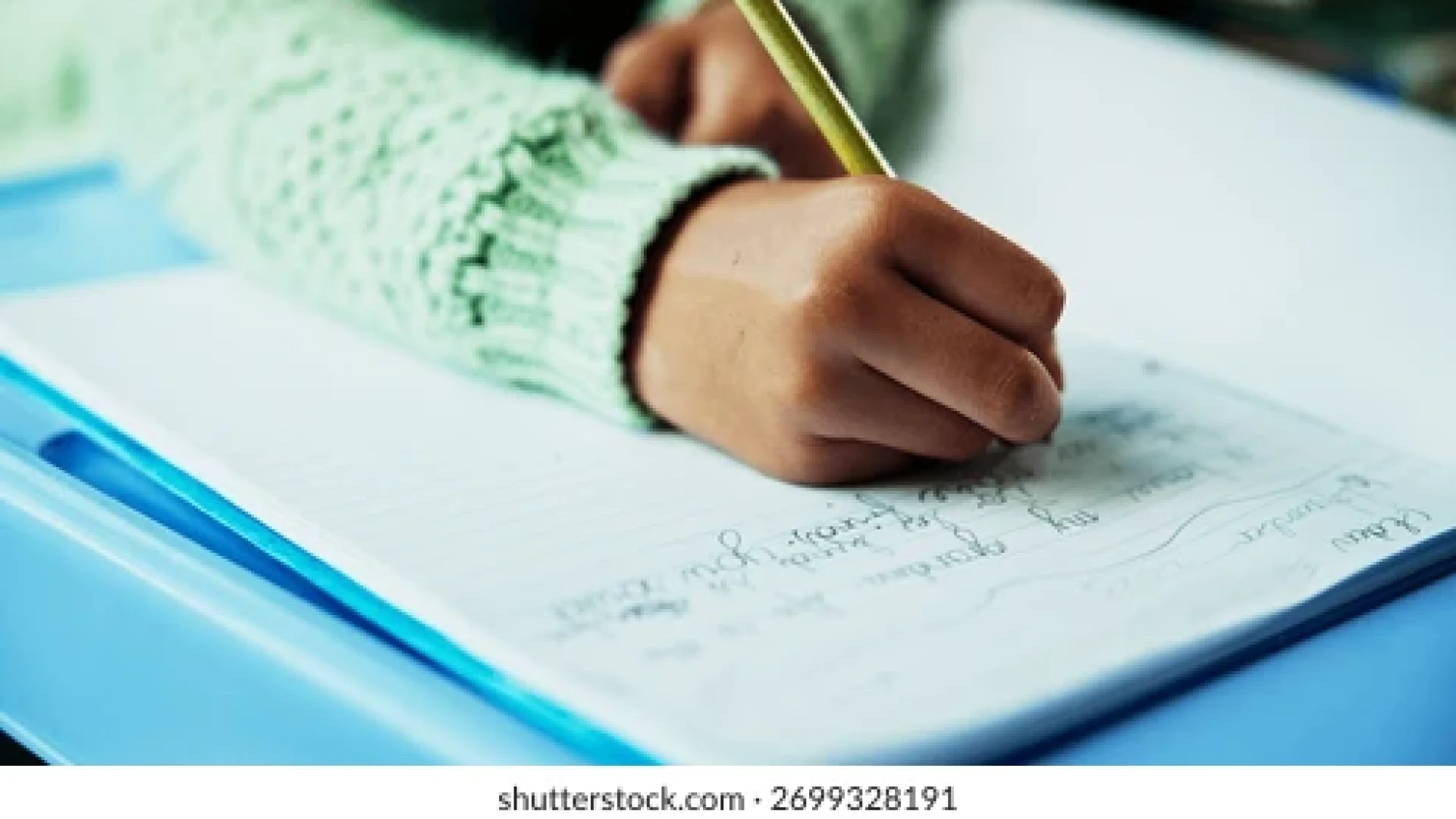 learning-hands-child-writing-classroom-260nw-2699328191